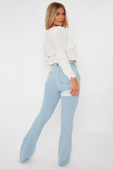 Light Blue Ripped Flare Jeans - Elze
